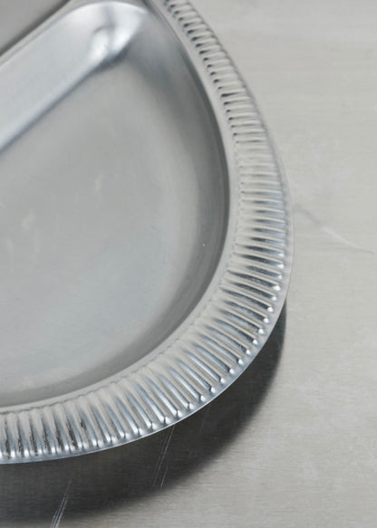 serviteur ovale en inox contour travaillé
